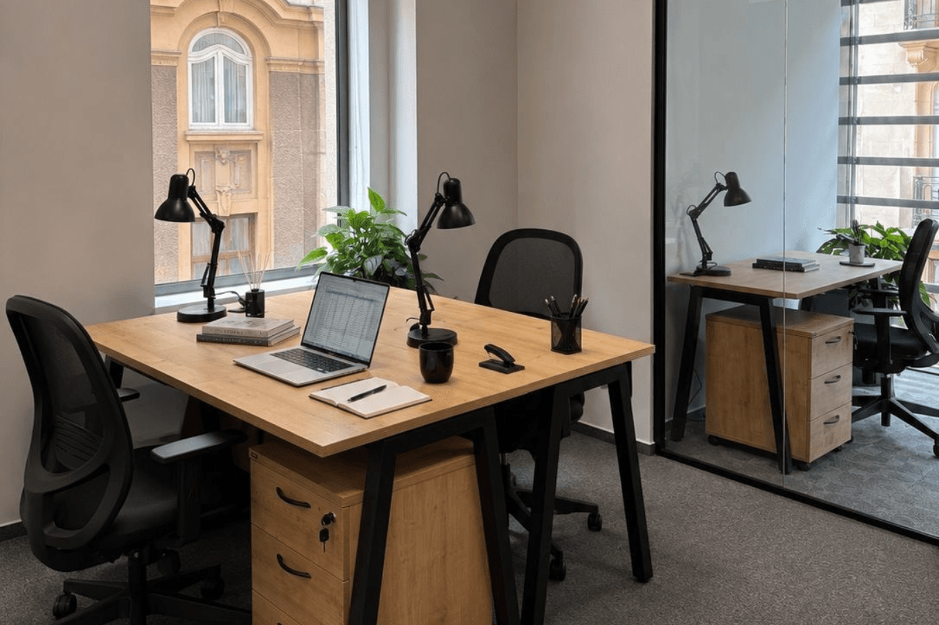 Two-person private office at Victoria Center with a window onto Calea Victoriei